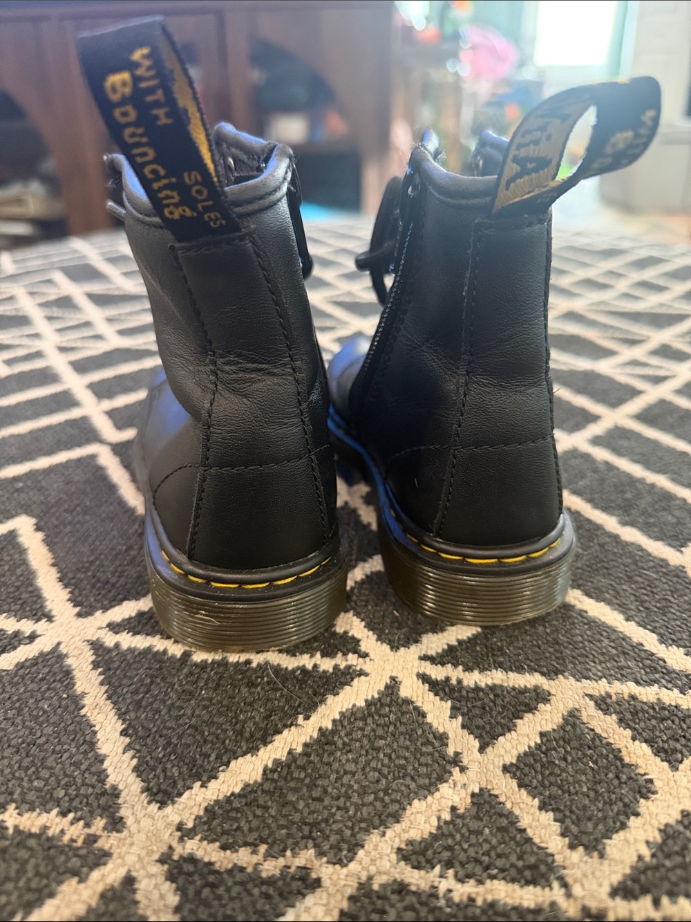 Dr. Martens Kids Black Leather Ankle Boots with Yellow Stitching